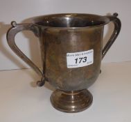 A George V silver two-handled cup of inverted bell form, raised on a circular foot (by The