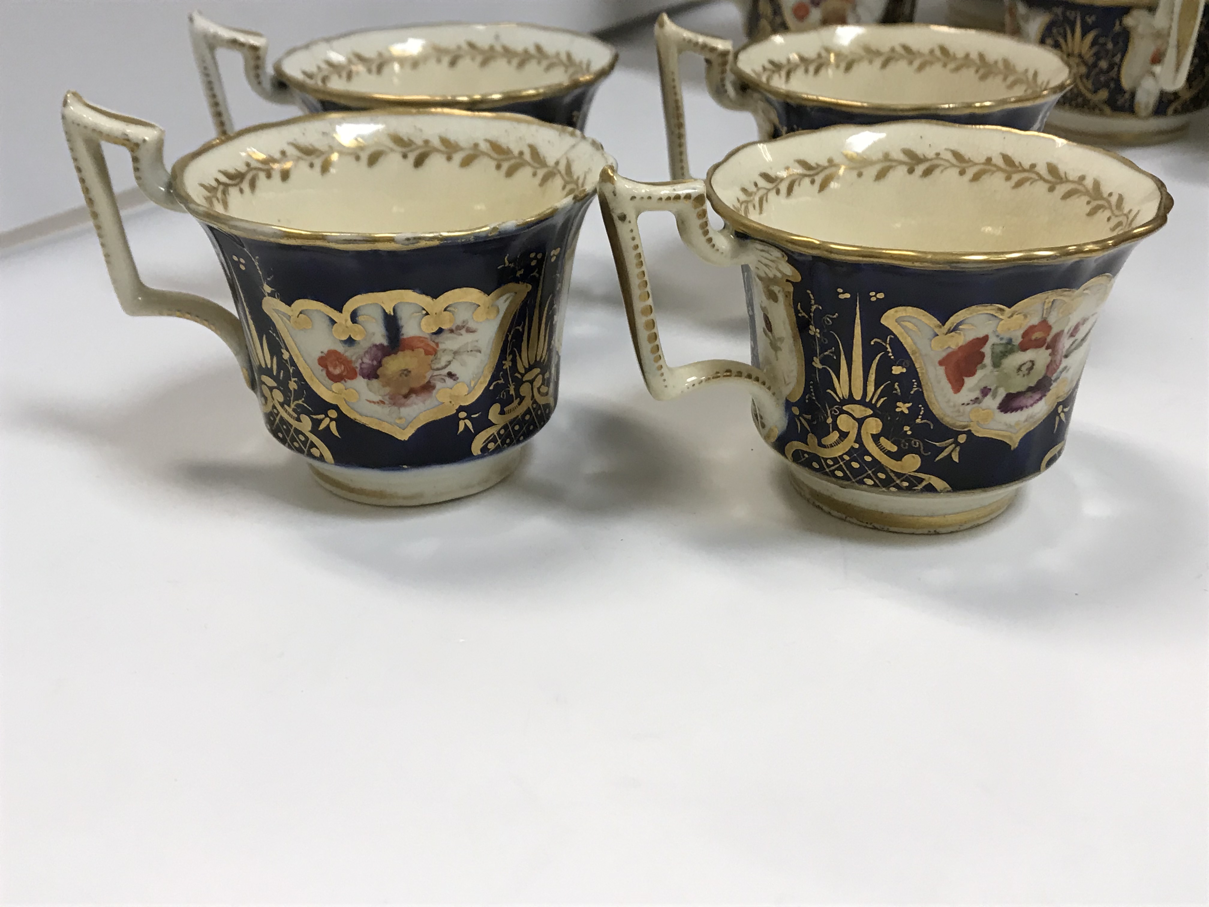 A 19th Century Staffordshire pottery part tea set, royal blue banded and gilt lined with panels of - Image 28 of 45