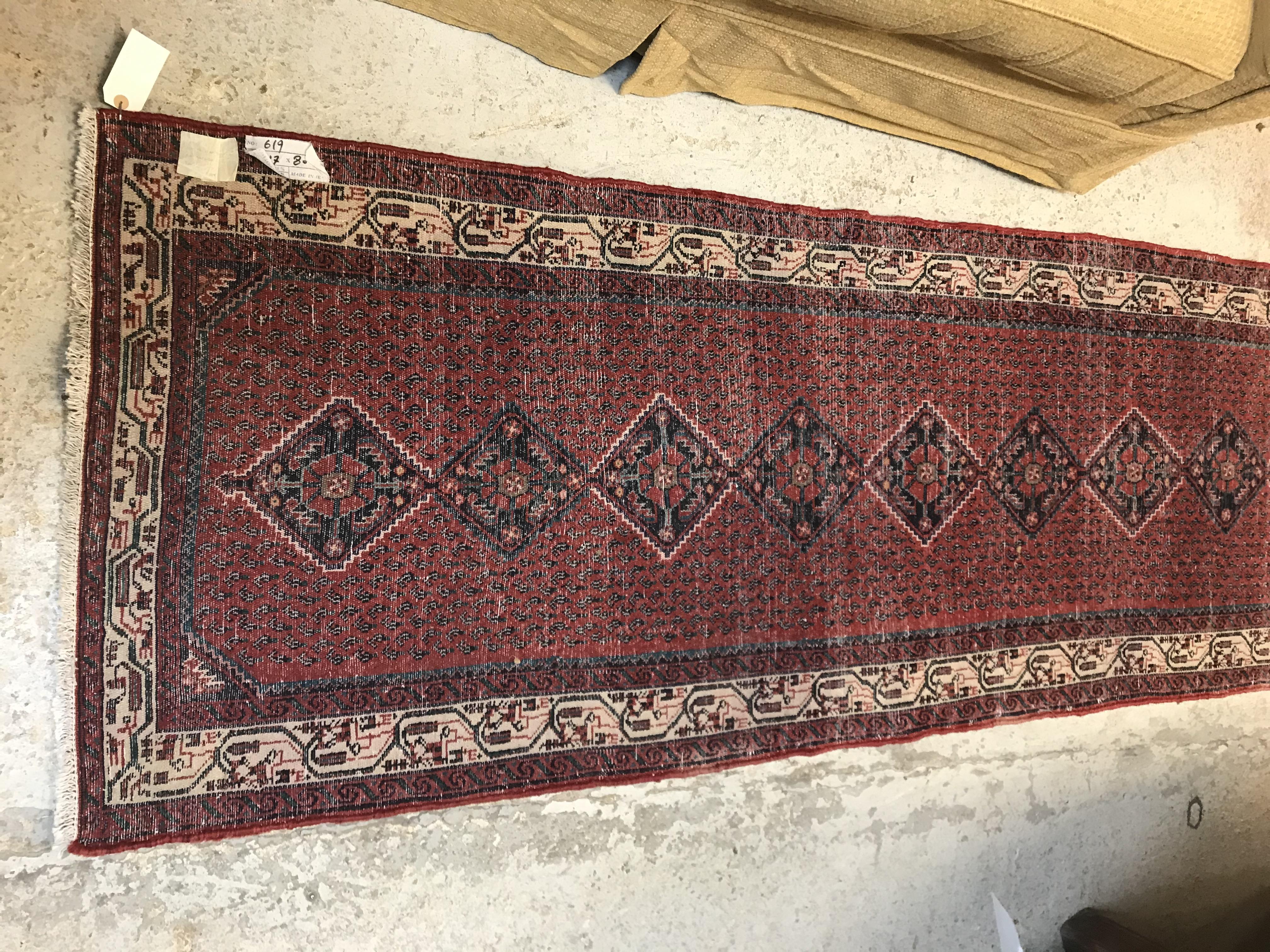 A modern Persian (Iran) runner, the red ground with repeating lozenge medallion with hook style - Image 20 of 23