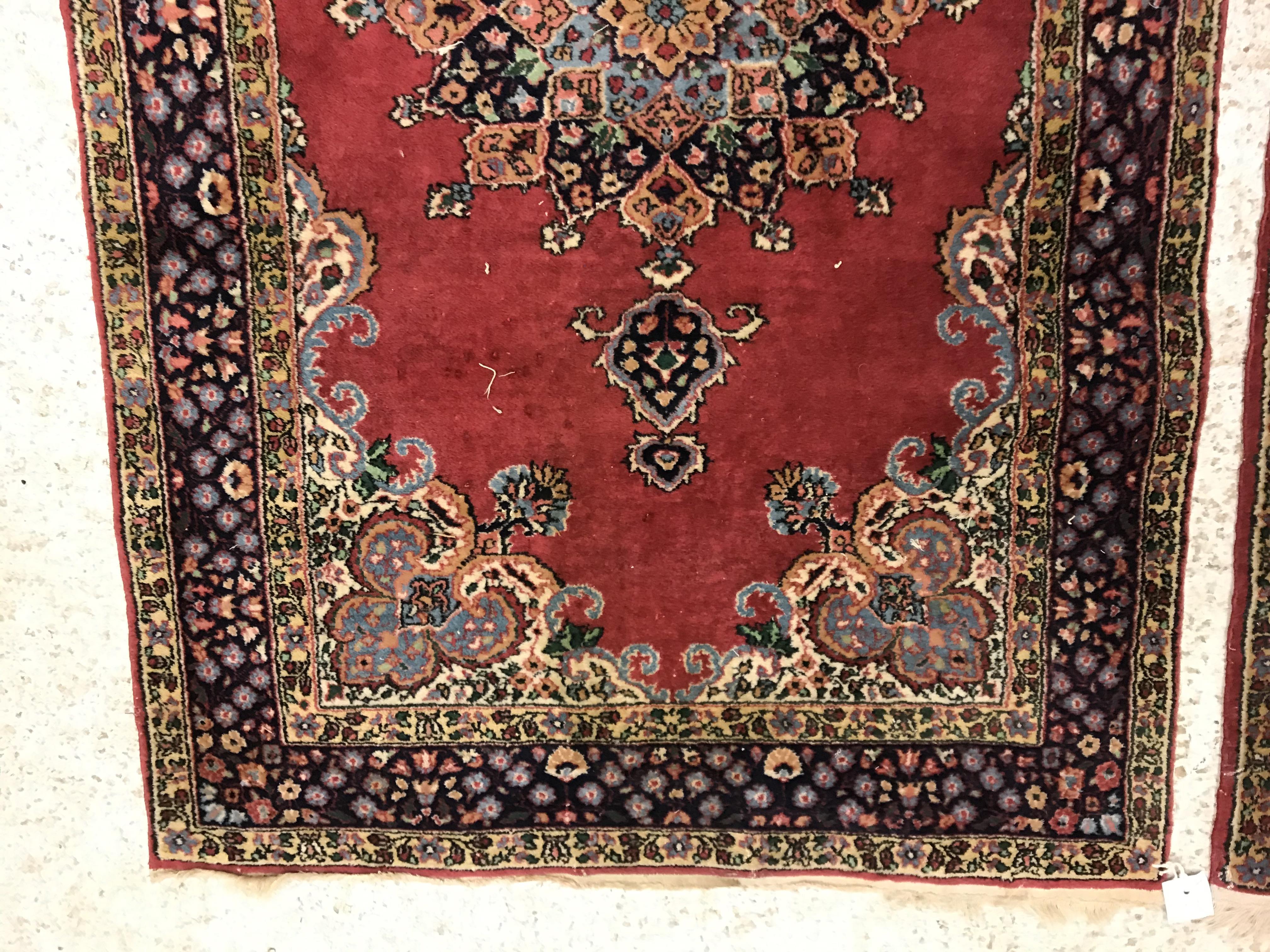 A pair of fine Oriental rugs, the central panels set with floral decorated circular medallion on a - Image 3 of 41