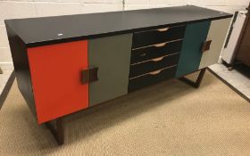 An upcycled Europa Furniture teak sideboard with four central drawers flanked by two cupboard doors,