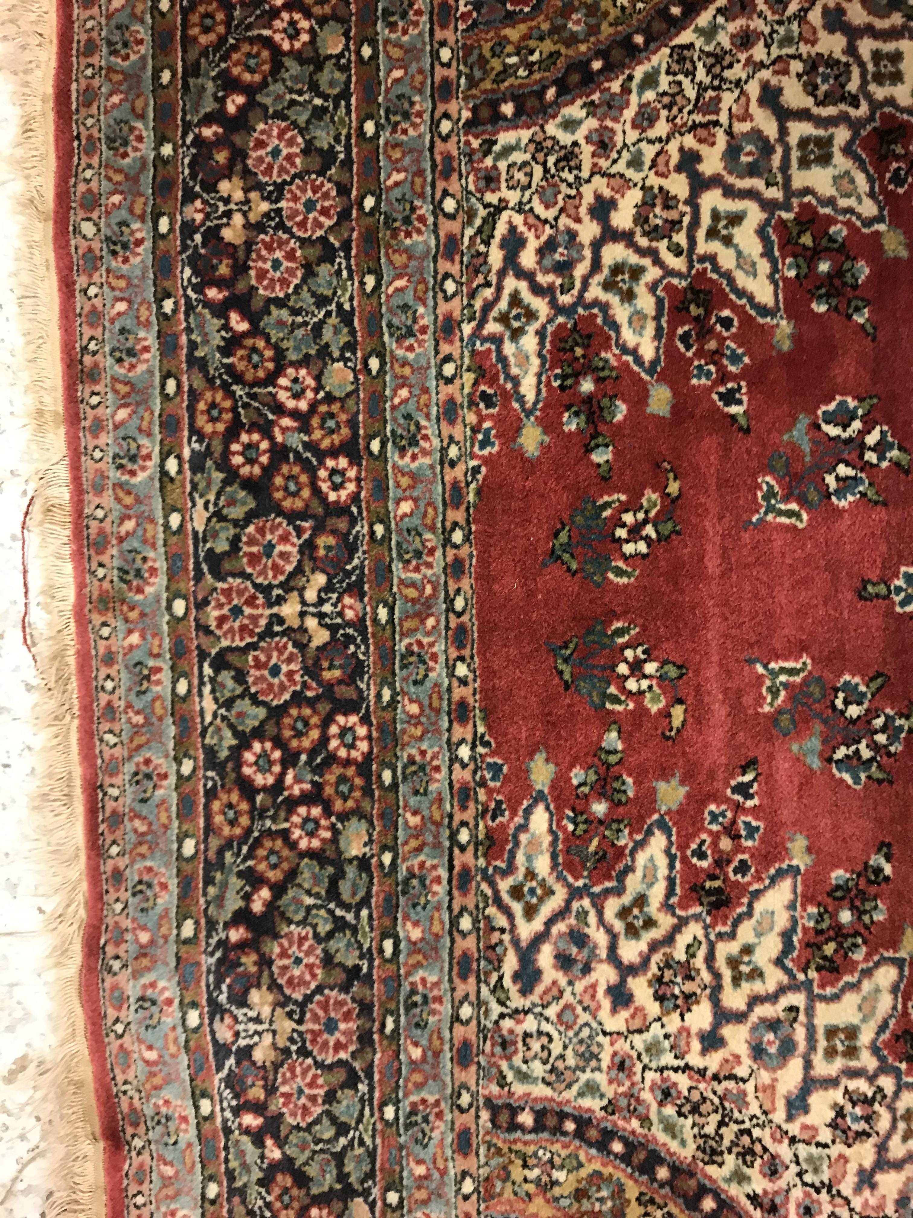 A pair of fine Oriental rugs, the central panel set with floral decorated circular medallion on a - Image 29 of 48