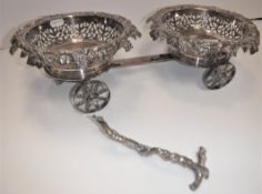 An early 19th Century Old Sheffield Plate decanter trolley with pierced, grape and vine decorated