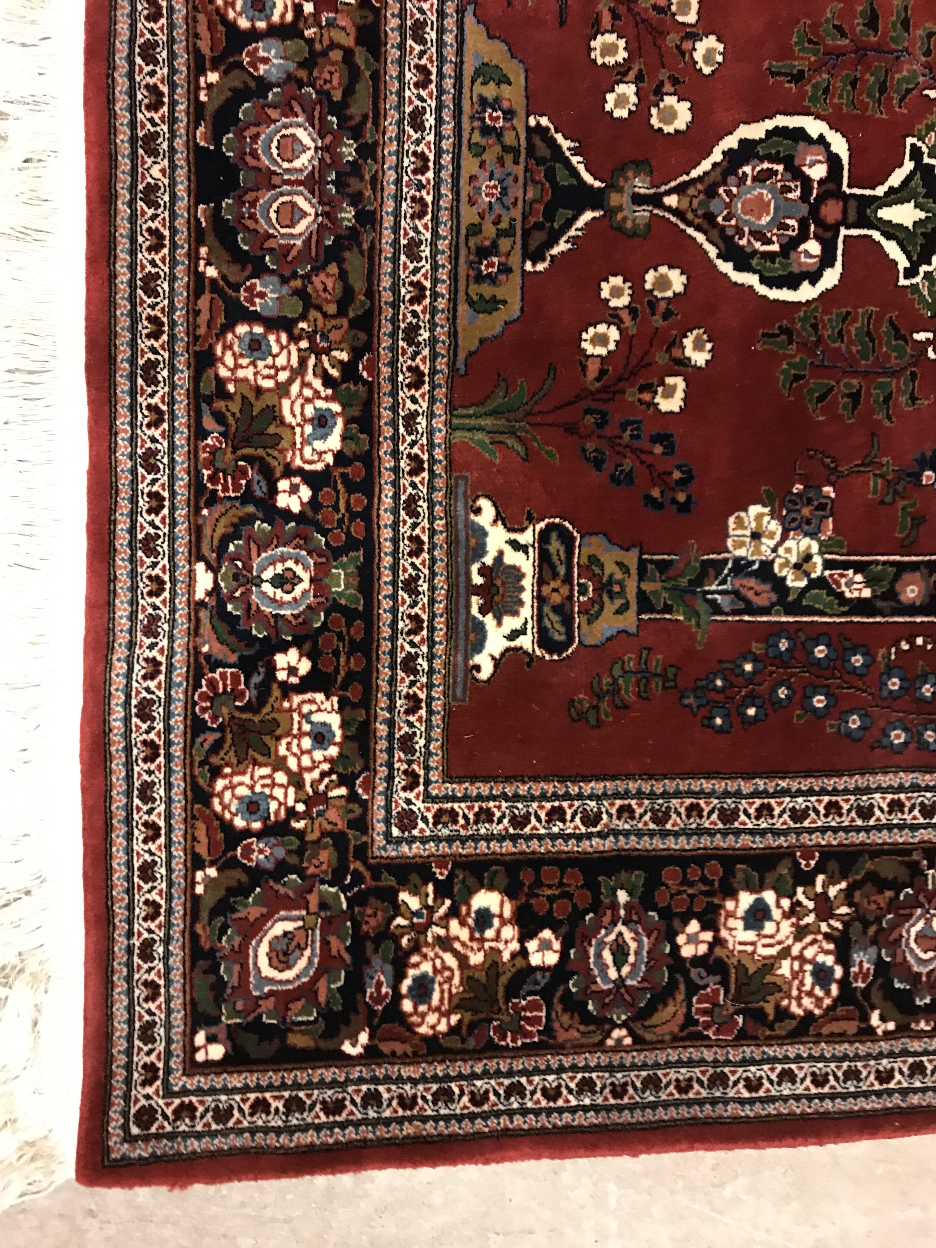 A Kashan prayer rug, the central panel set with Mirhab design with vase of flowers to base, on a red - Image 3 of 13