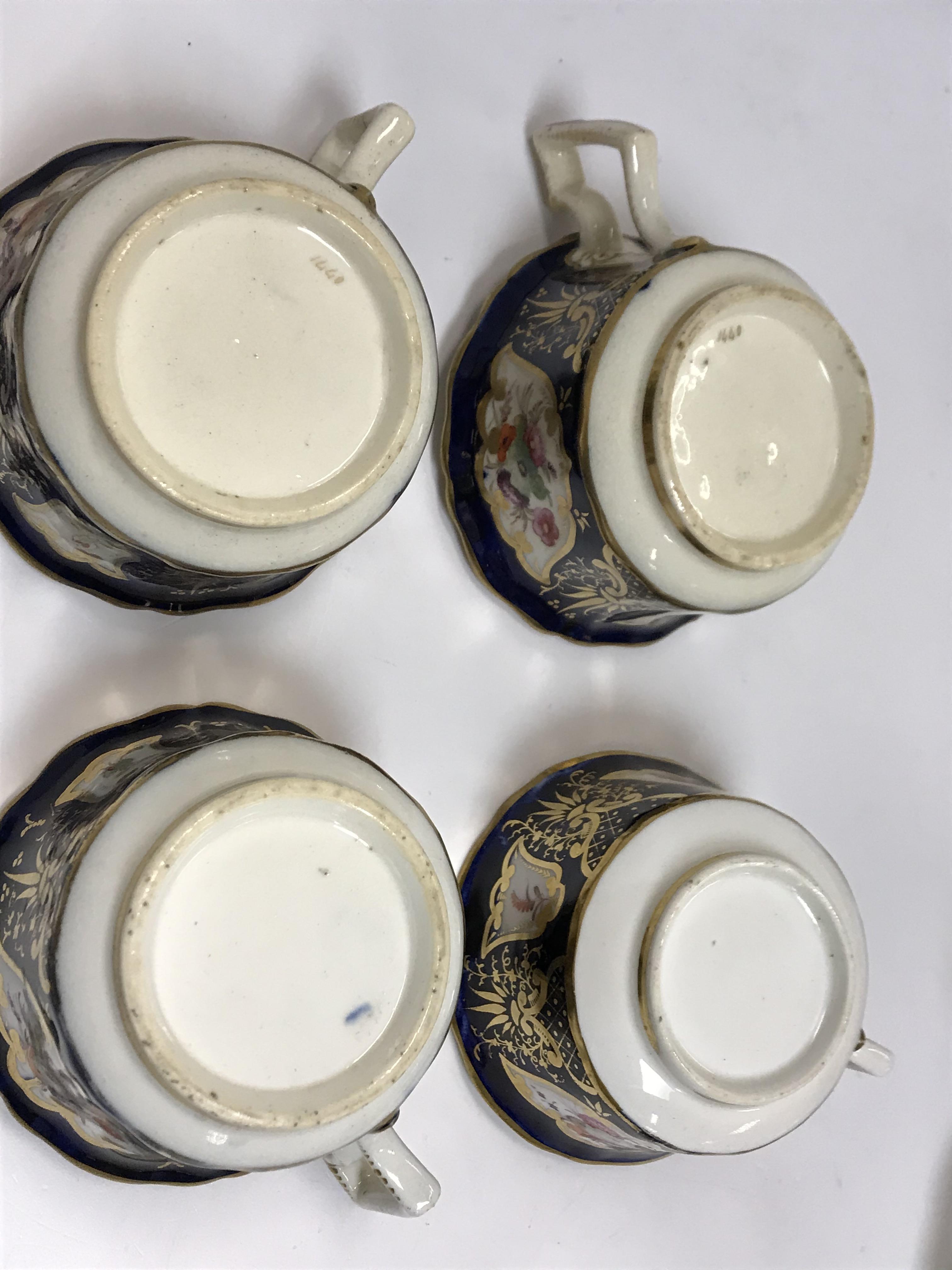 A 19th Century Staffordshire pottery part tea set, royal blue banded and gilt lined with panels of - Image 22 of 45