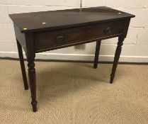 A Victorian mahogany single drawer side table on turned and ringed tapering legs to peg feet, 96