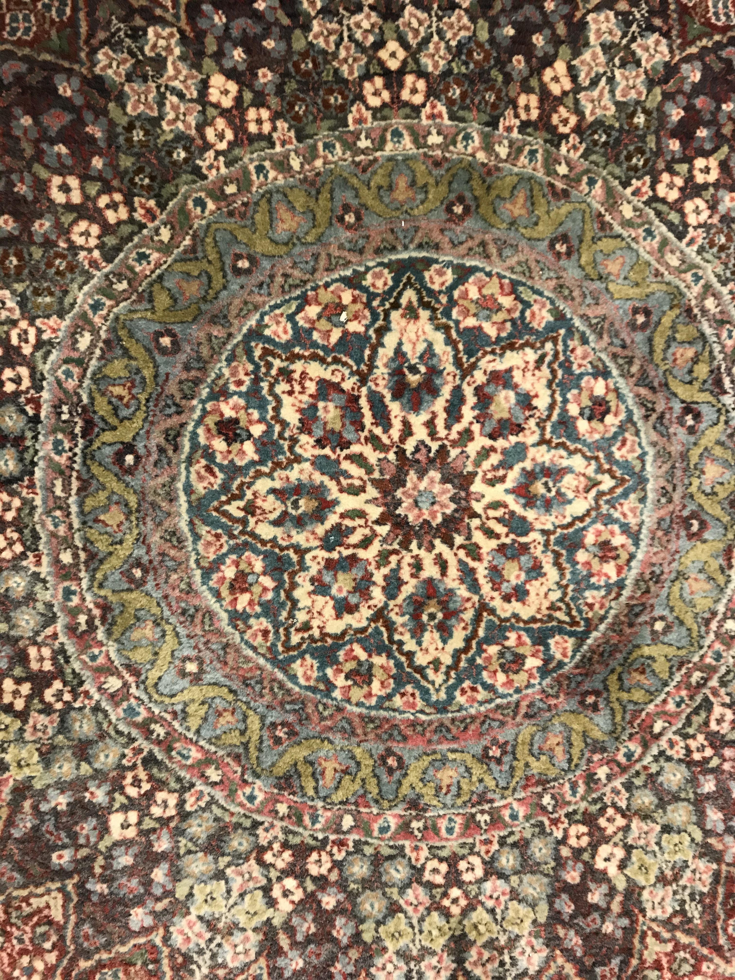 A pair of fine Oriental rugs, the central panels each set with floral decorated circular medallion - Image 32 of 41