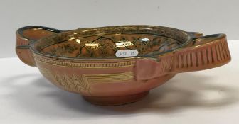 A Zsolnay Pecs two-handled dish, polychrome decorated with gilt highlighting and decorated with