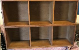 A suite of oak open bookshelves, some with sliding doors, others with pigeon holesCondition