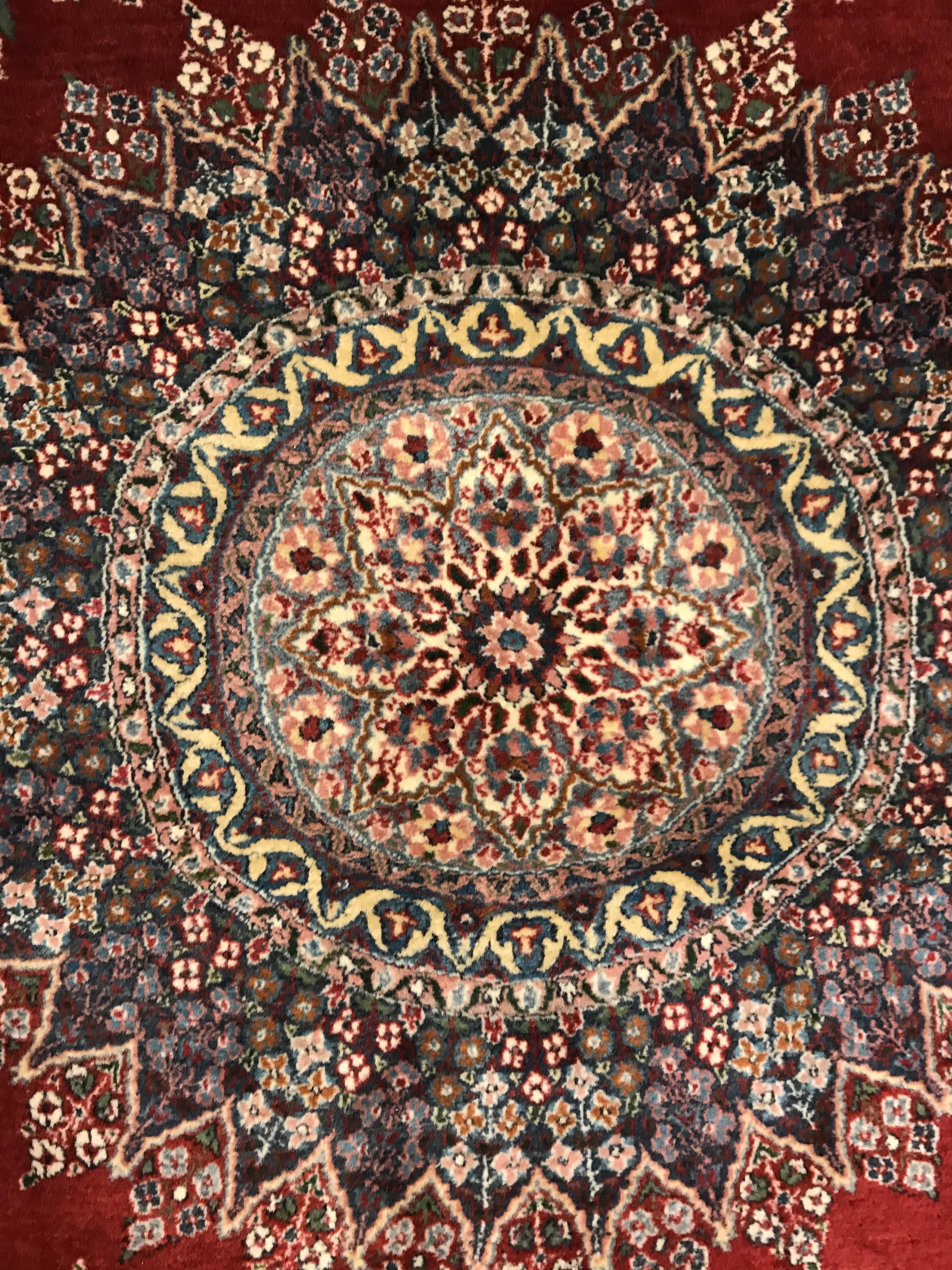 A pair of fine Oriental rugs, the central panels each set with floral decorated circular medallion - Image 18 of 41