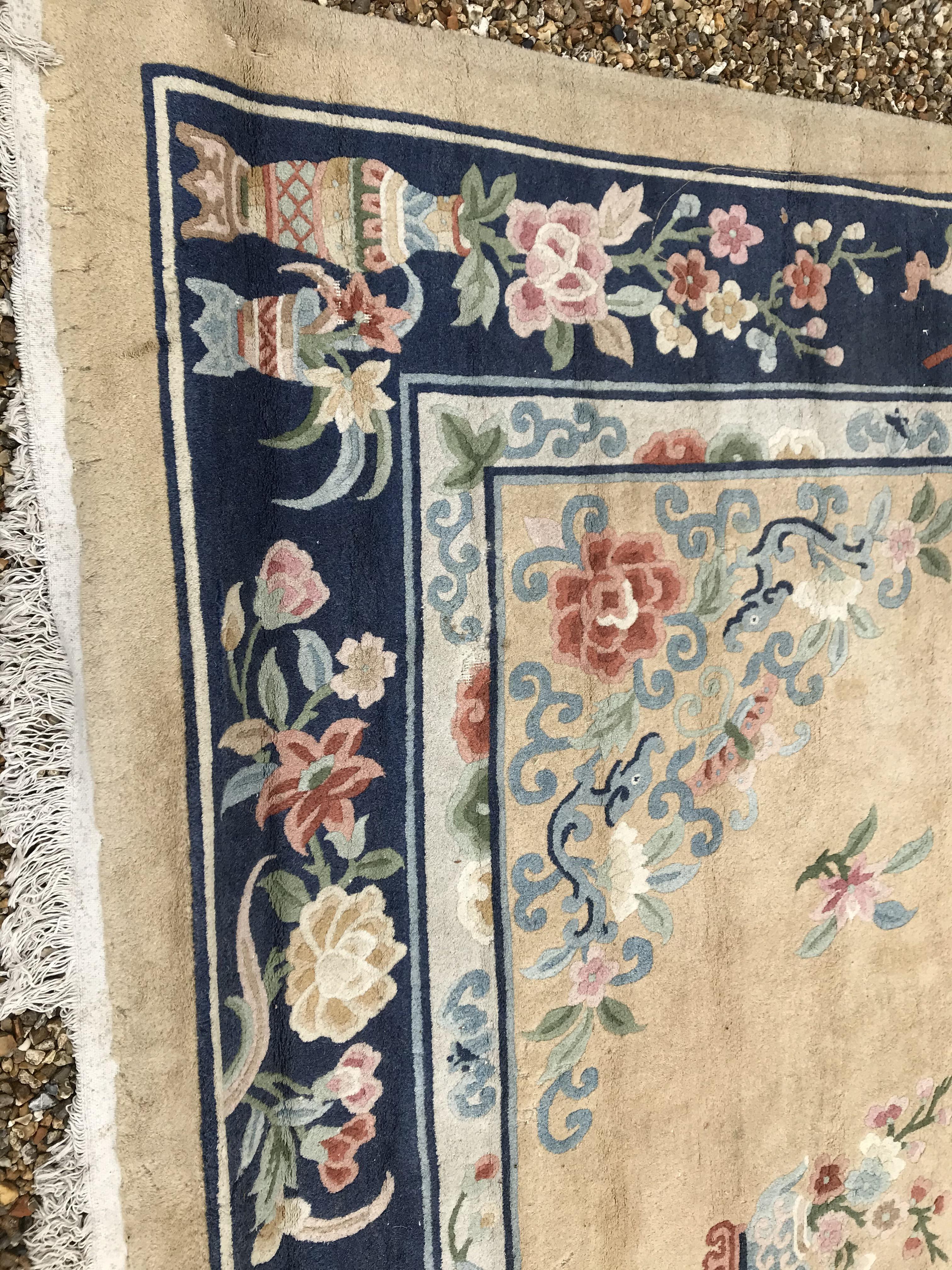 A Chinese Superwash rug, the central panel set with dragon motif on a gold ground, set with floral - Image 4 of 21