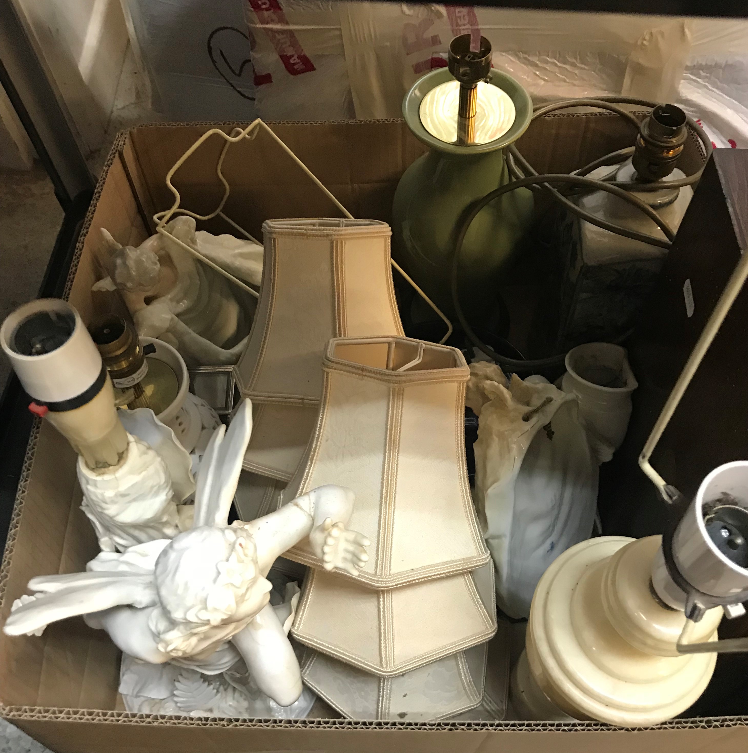 Three boxes of assorted sundry items to include various table lamps, cushions and a Victorian