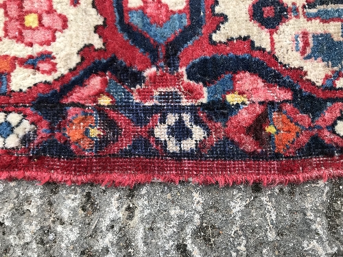 A Caucasian carpet, the central panel set with a flower head medallion on a red ground, with all - Image 3 of 10