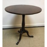 A 19th Century oak circular tilt-top tripod occasional table, 64.5 cm diameter x 73.5 cm high