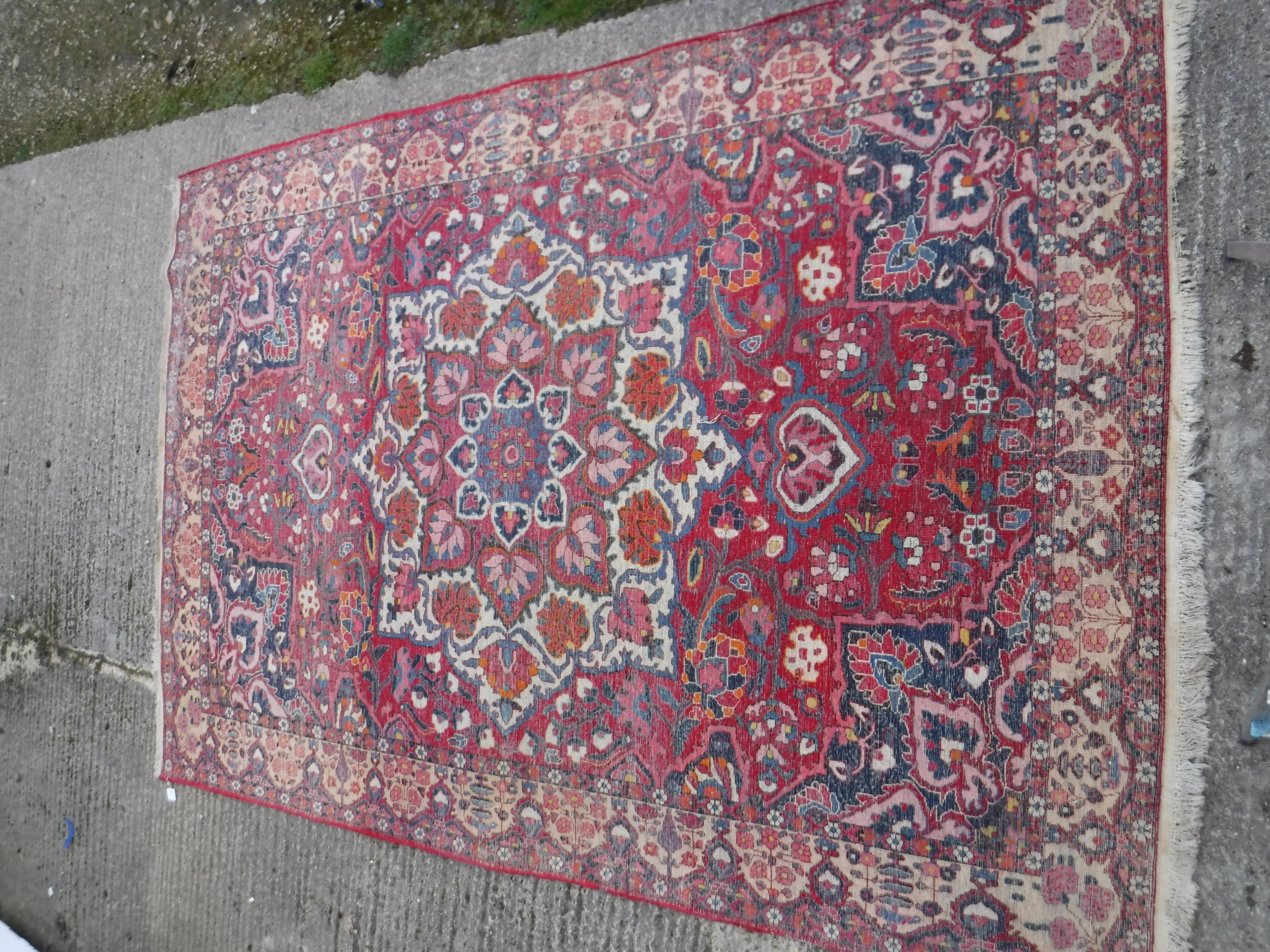 A Caucasian carpet, the central panel set with a flower head medallion on a red ground, with all - Image 10 of 10