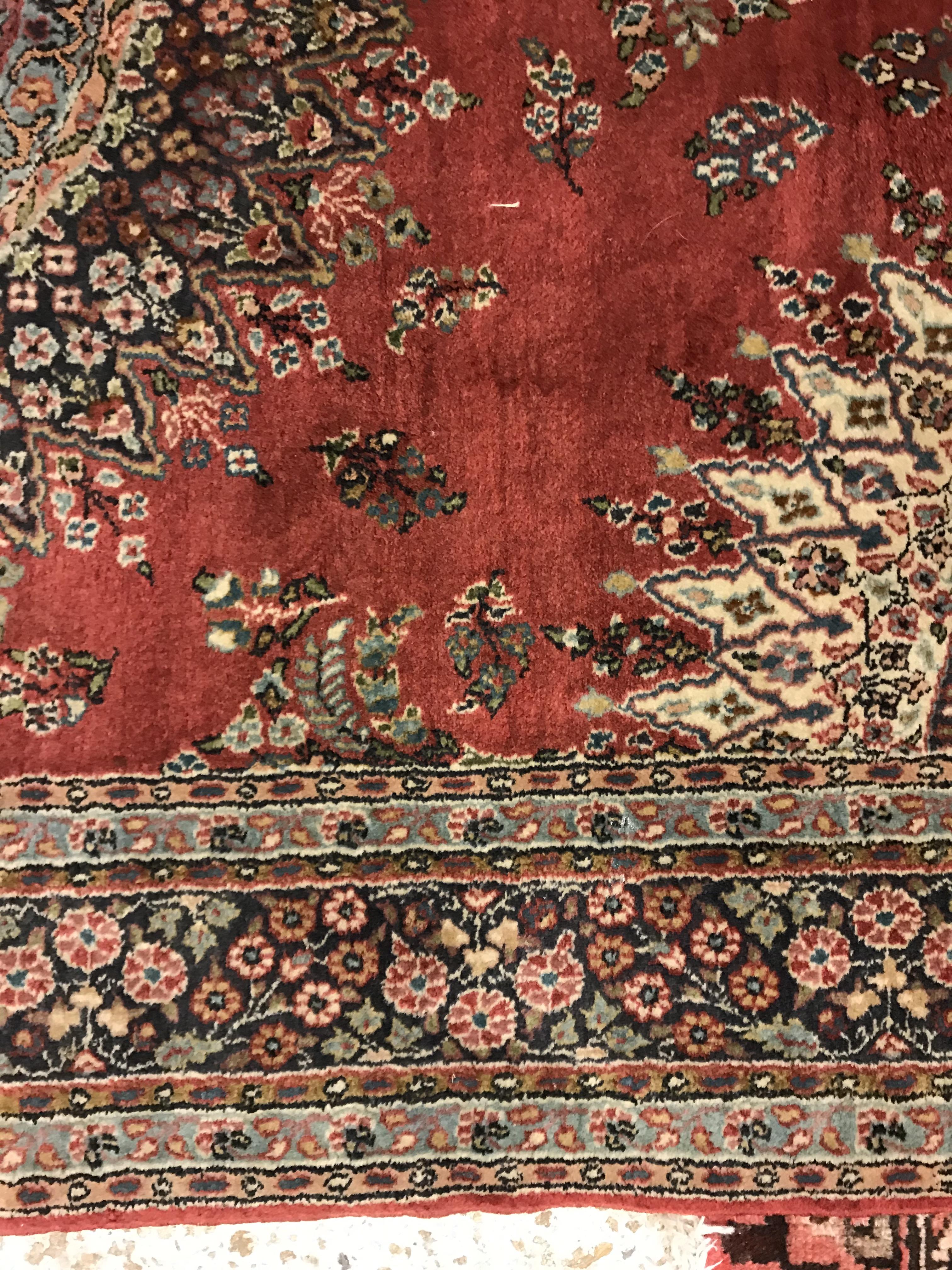 A pair of fine Oriental rugs, the central panel set with floral decorated circular medallion on a - Image 21 of 48