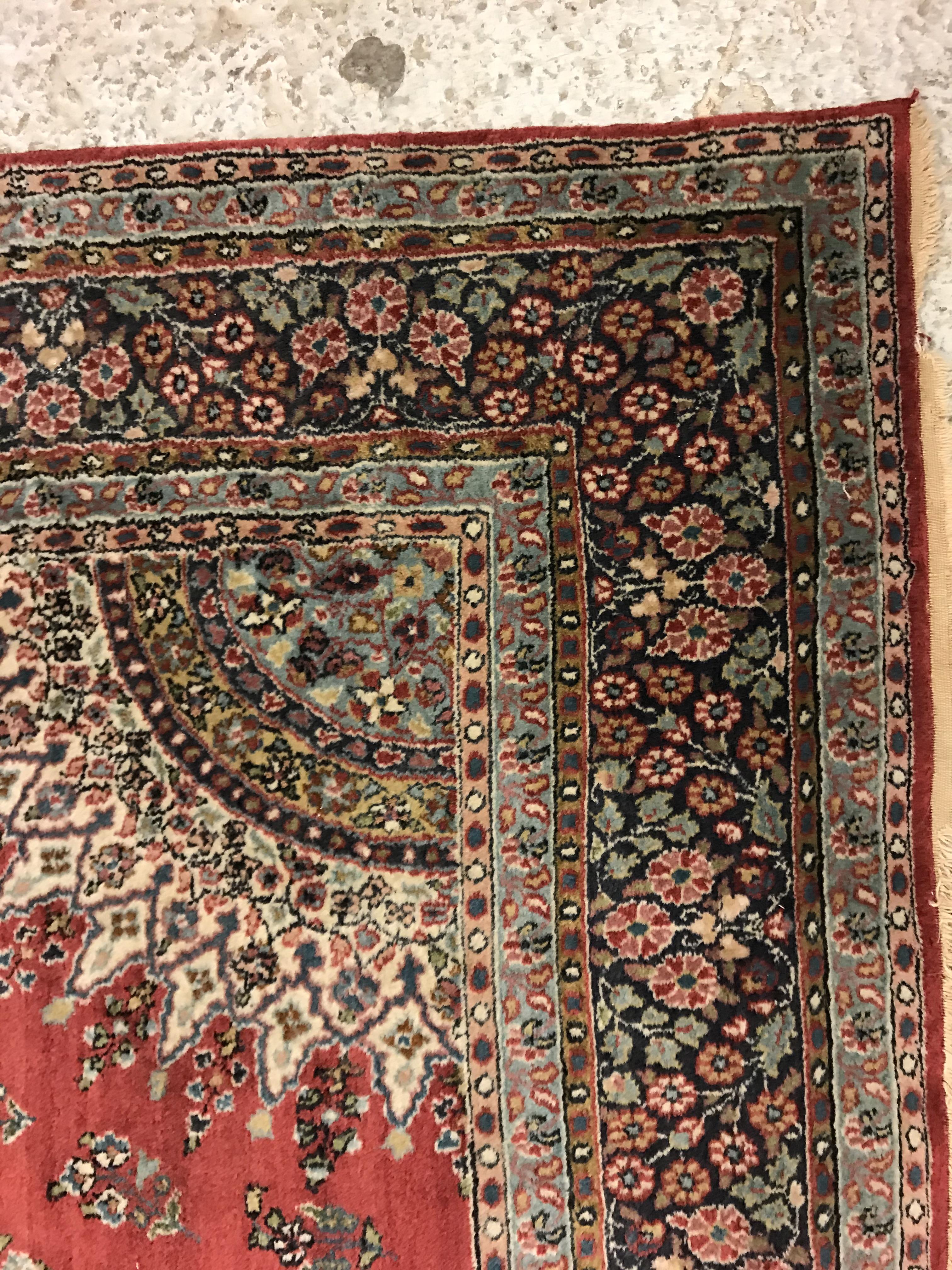 A pair of fine Oriental rugs, the central panel set with floral decorated circular medallion on a - Image 18 of 48
