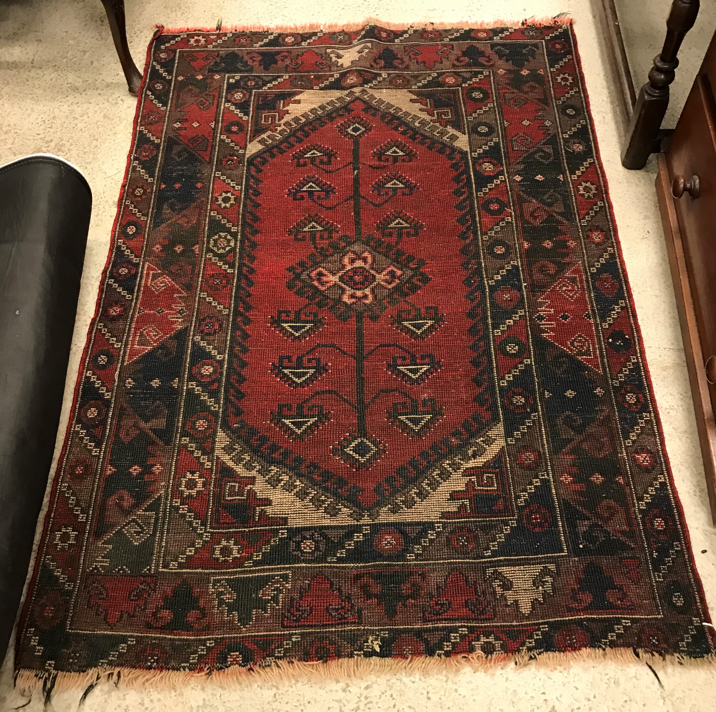 A Shiraz rug, the central panel set with lozenge shaped medallion on a red and cream ground within a - Image 2 of 2