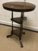 A Victorian rosewood occasional table, the circular top on a tripod twin platform base to splayed