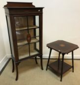 An Edwardian mahogany and inlaid display cabinet with single door on splayed supports, 57 cm wide