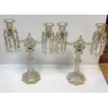 A pair of Continental etched and gilded octagonal glass table candelabra, the twin branch candle