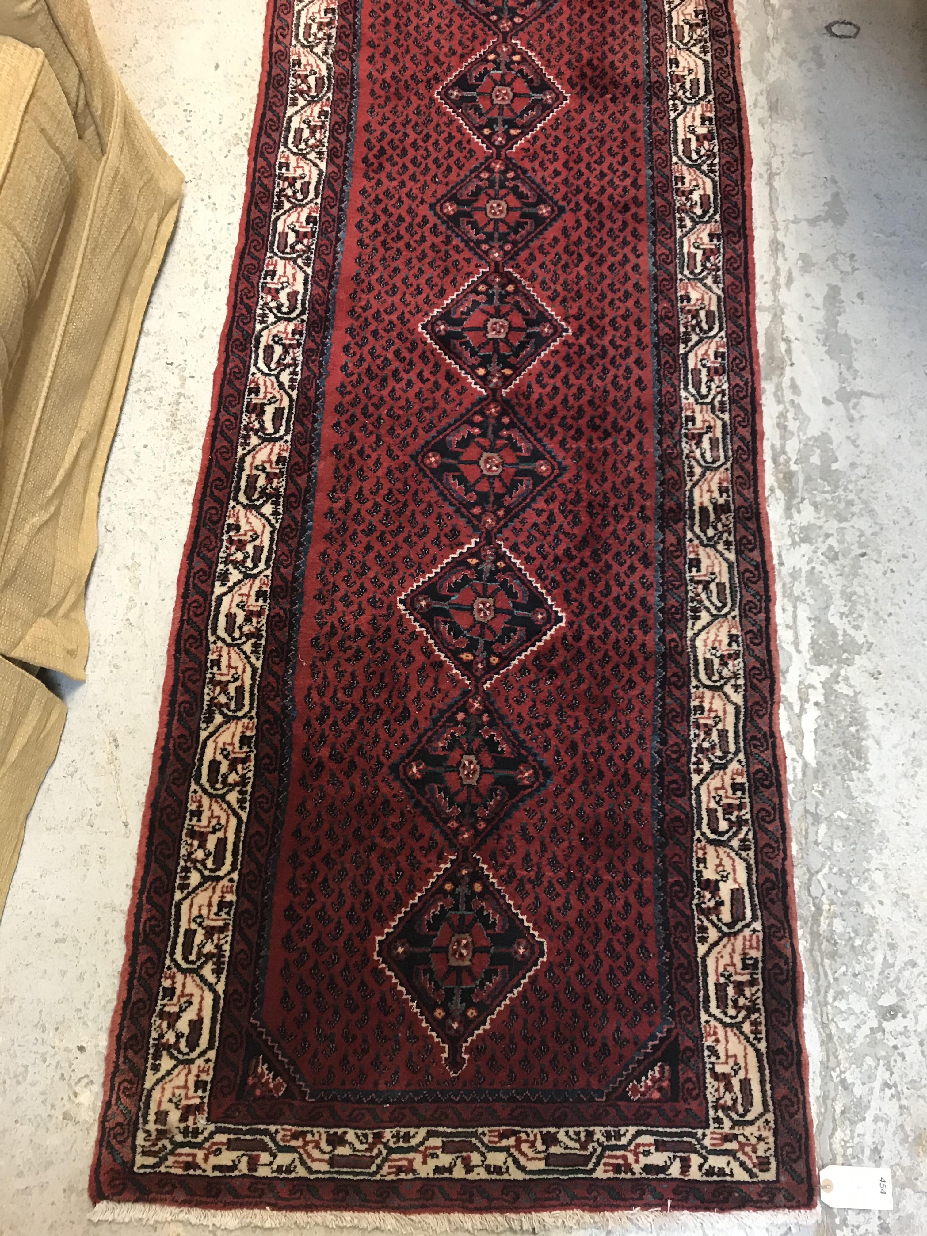 A modern Persian (Iran) runner, the red ground with repeating lozenge medallion with hook style - Image 3 of 23