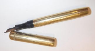 A Conway Stewart 9 carat gold cased fountain pen, the lid inscribed with initials "J.C.L", the