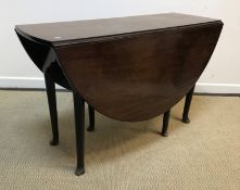 A 19th Century mahogany oval drop-leaf dining table on turned tapering legs to pad feet, 121 cm wide