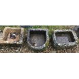 A collection of three various natural stone garden troughs to include a D end example, 50 cm wide