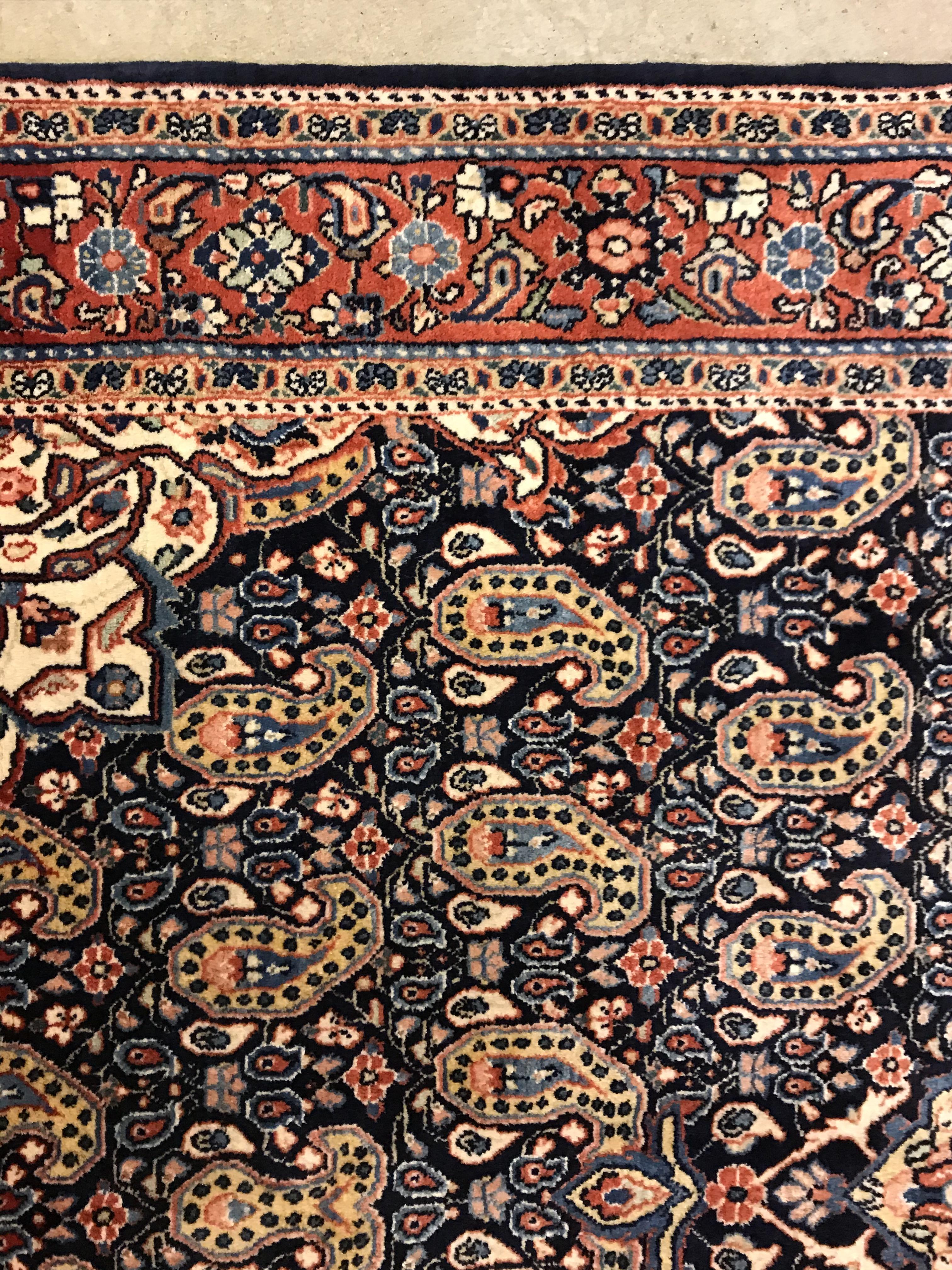 A Kashan carpet, the central panel set with floral decorated medallion on a dark blue hook decorated - Image 6 of 14