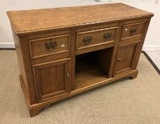 An oak dresser in the Victorian manner, the top with moulded edge above three drawers and dog kennel