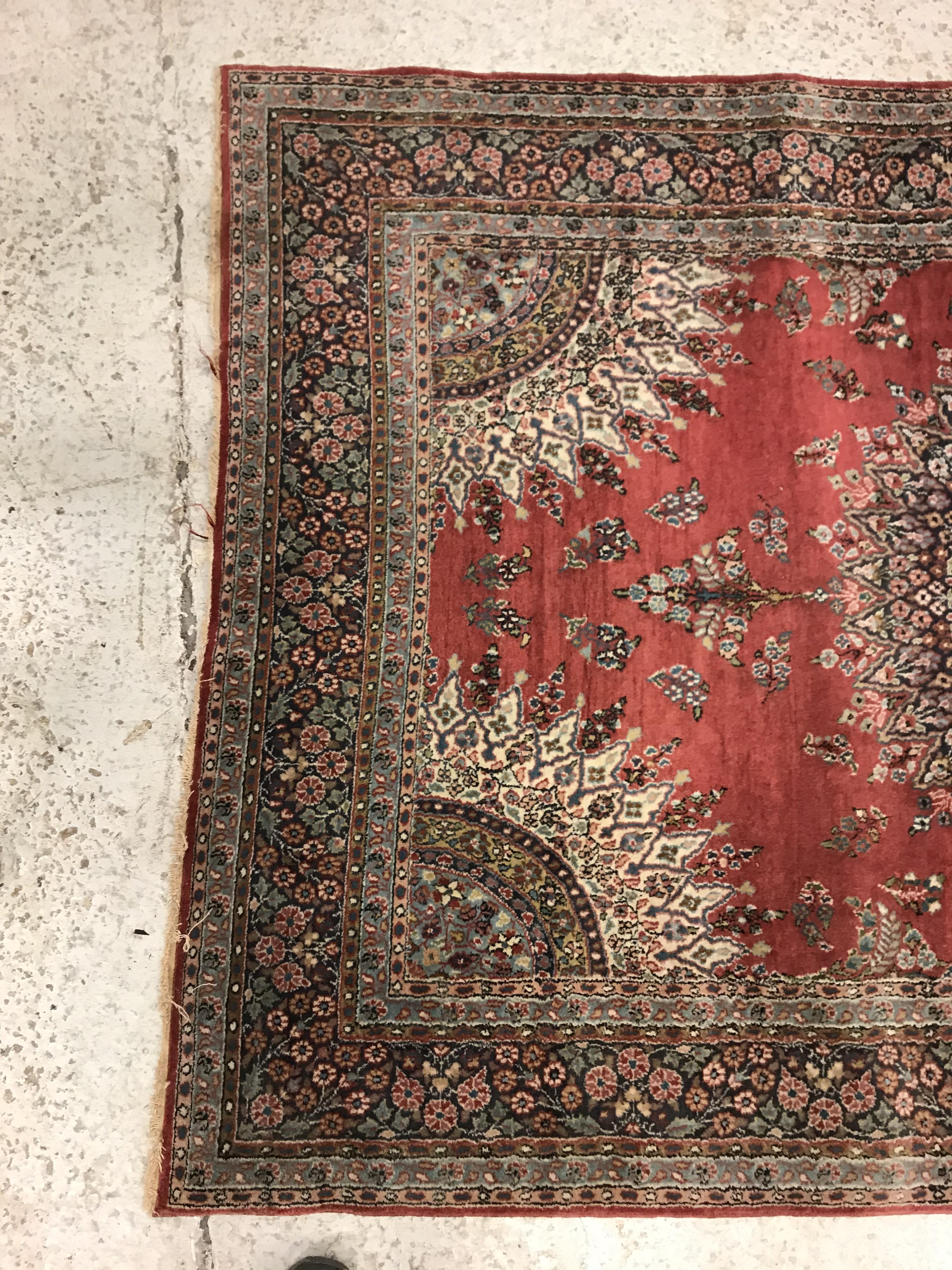 A pair of fine Oriental rugs, the central panel set with floral decorated circular medallion on a - Image 7 of 48
