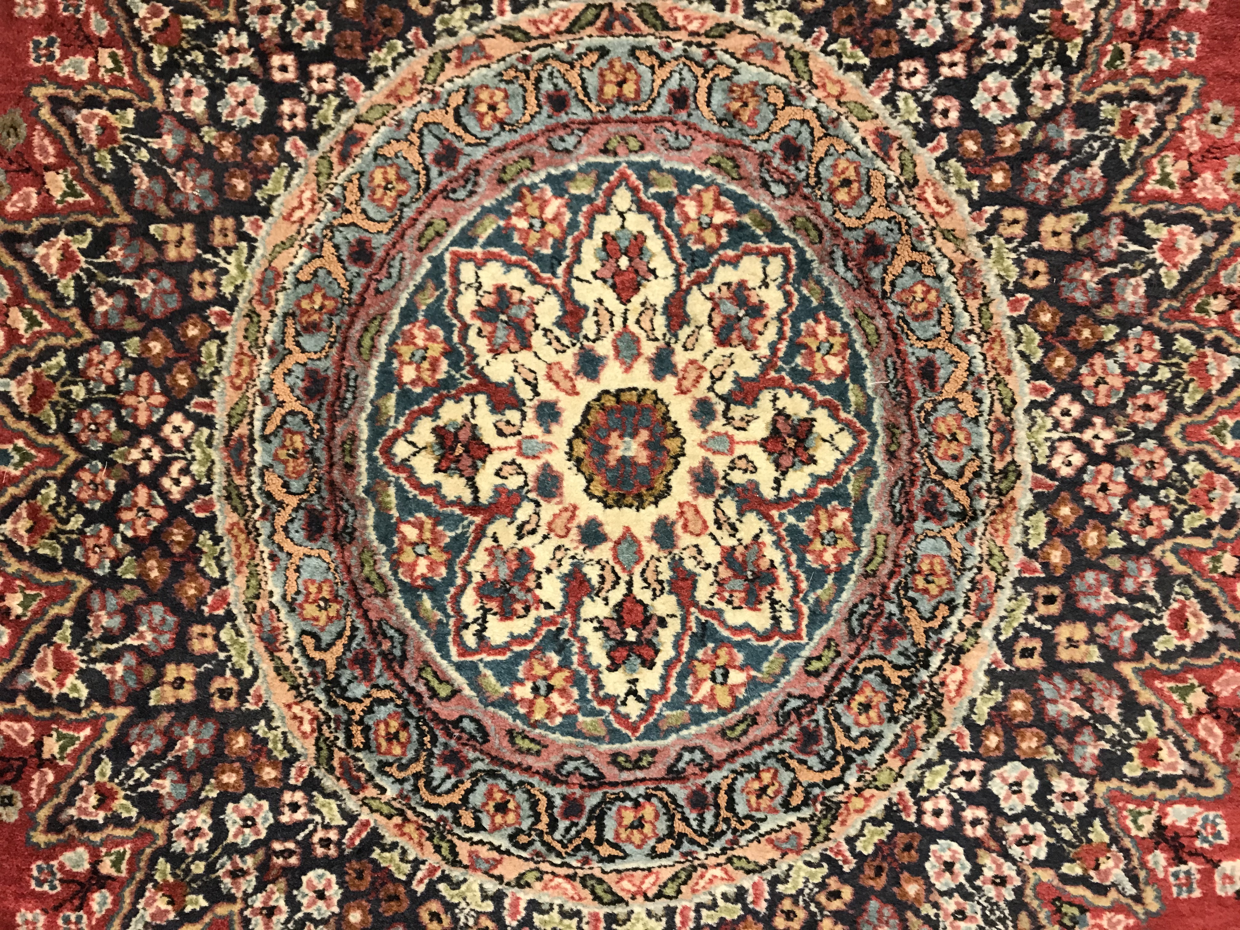 A pair of fine Oriental rugs, the central panel set with floral decorated circular medallion on a - Image 40 of 48