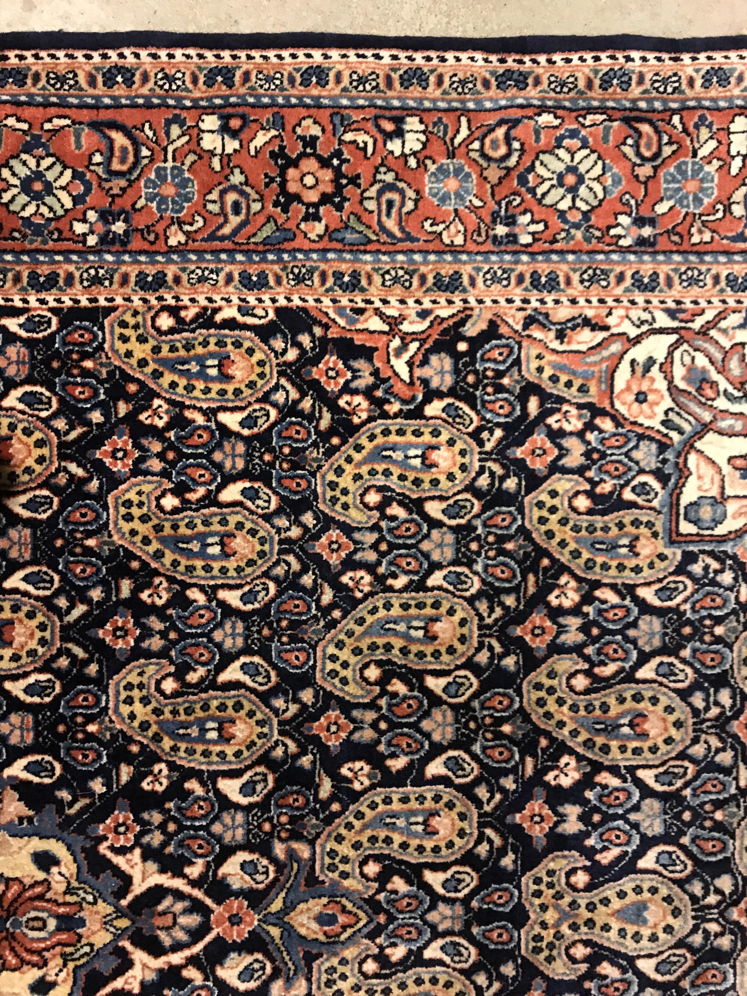 A Kashan carpet, the central panel set with floral decorated medallion on a dark blue hook decorated - Image 10 of 14