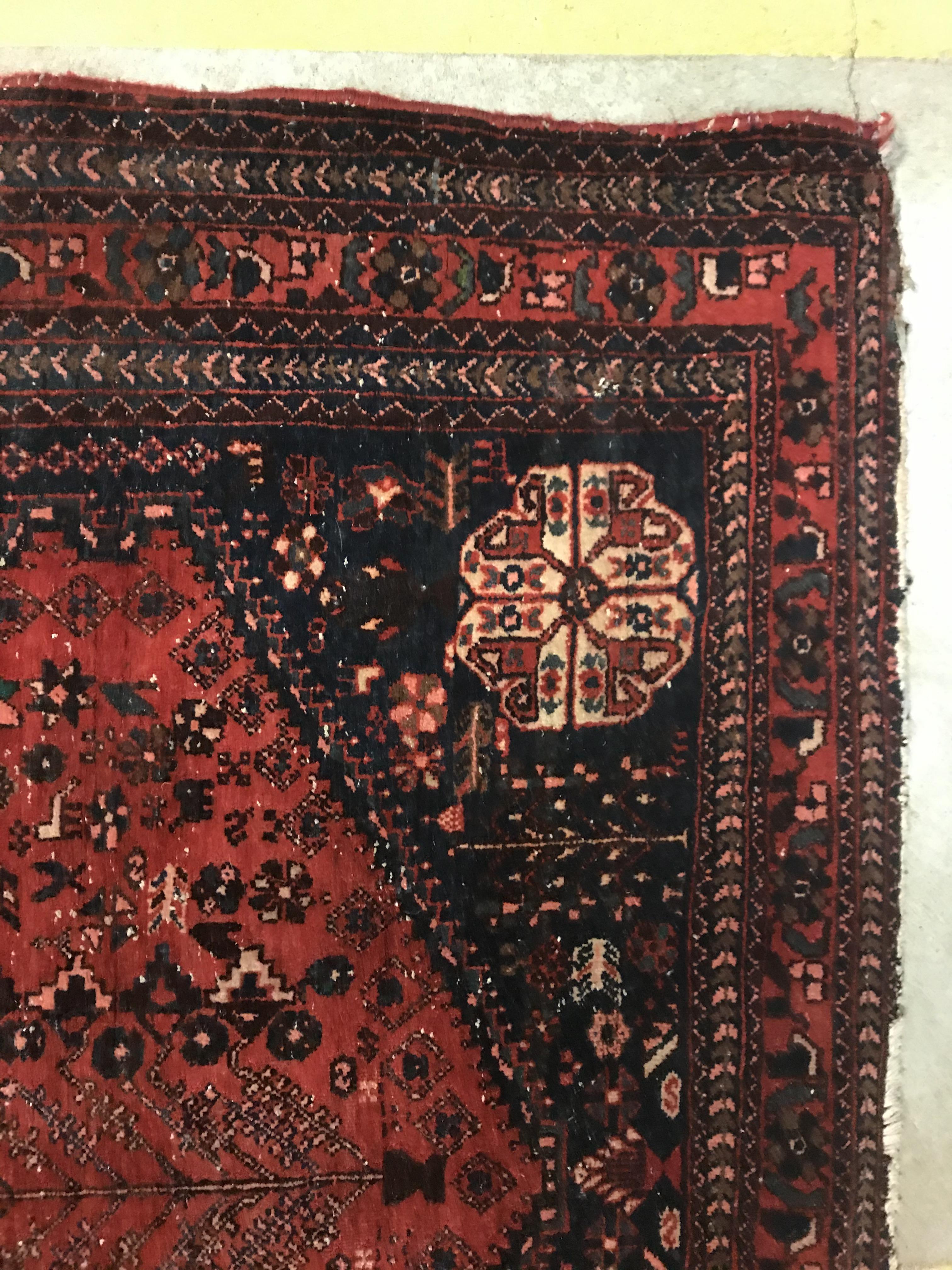 A Caucasian rug, the central panel set with three repeating medallions on a pale blue ground, within - Image 22 of 33