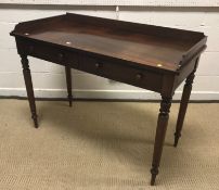 A Victorian mahogany washstand, the three quartered galleried top over two frieze drawers with