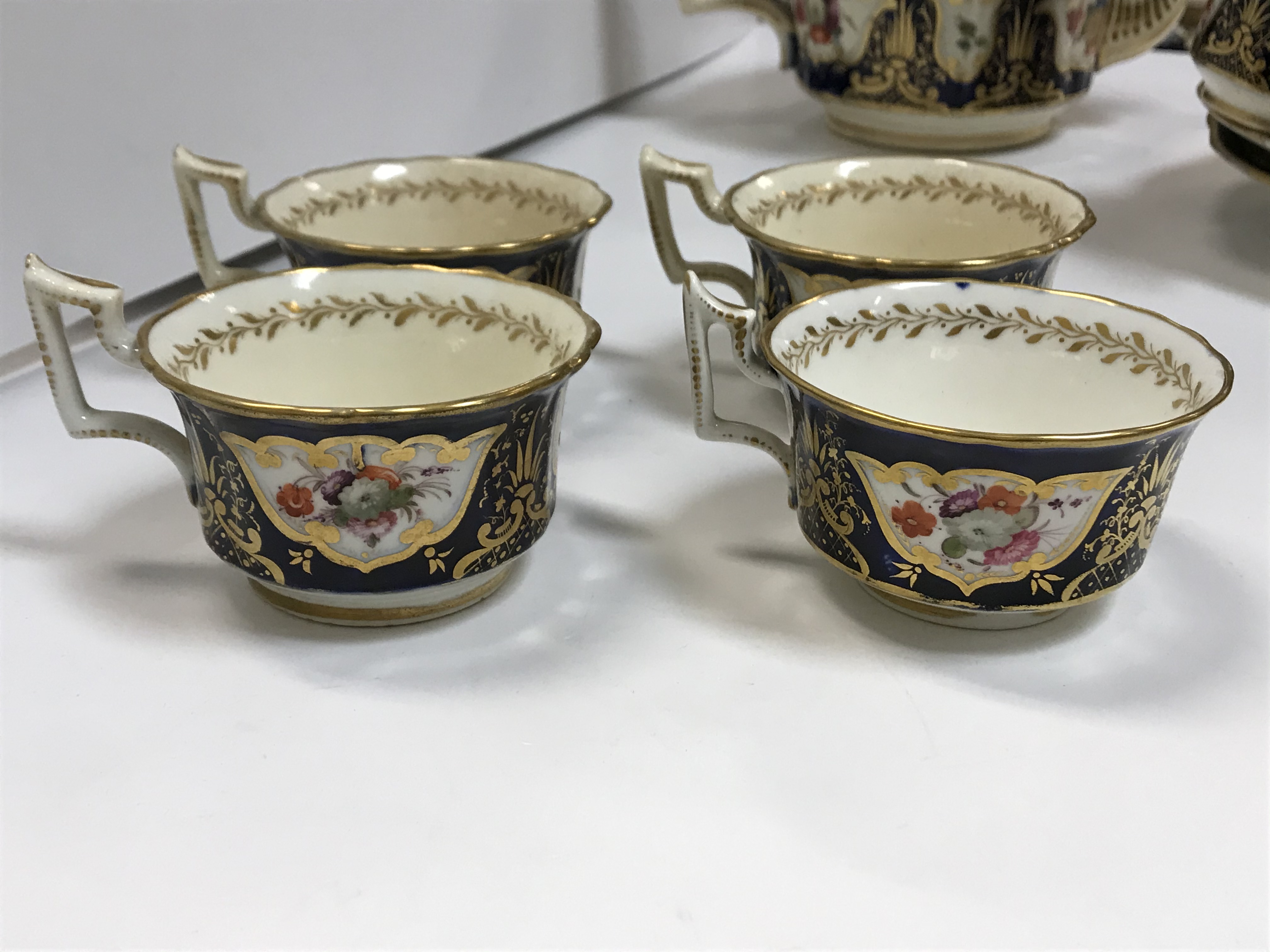 A 19th Century Staffordshire pottery part tea set, royal blue banded and gilt lined with panels of - Image 21 of 45
