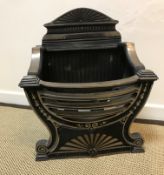 A 20th Century cast iron fire basket in the Regency style, 48 cm wide x 31 cm deep x 56.5 cm high