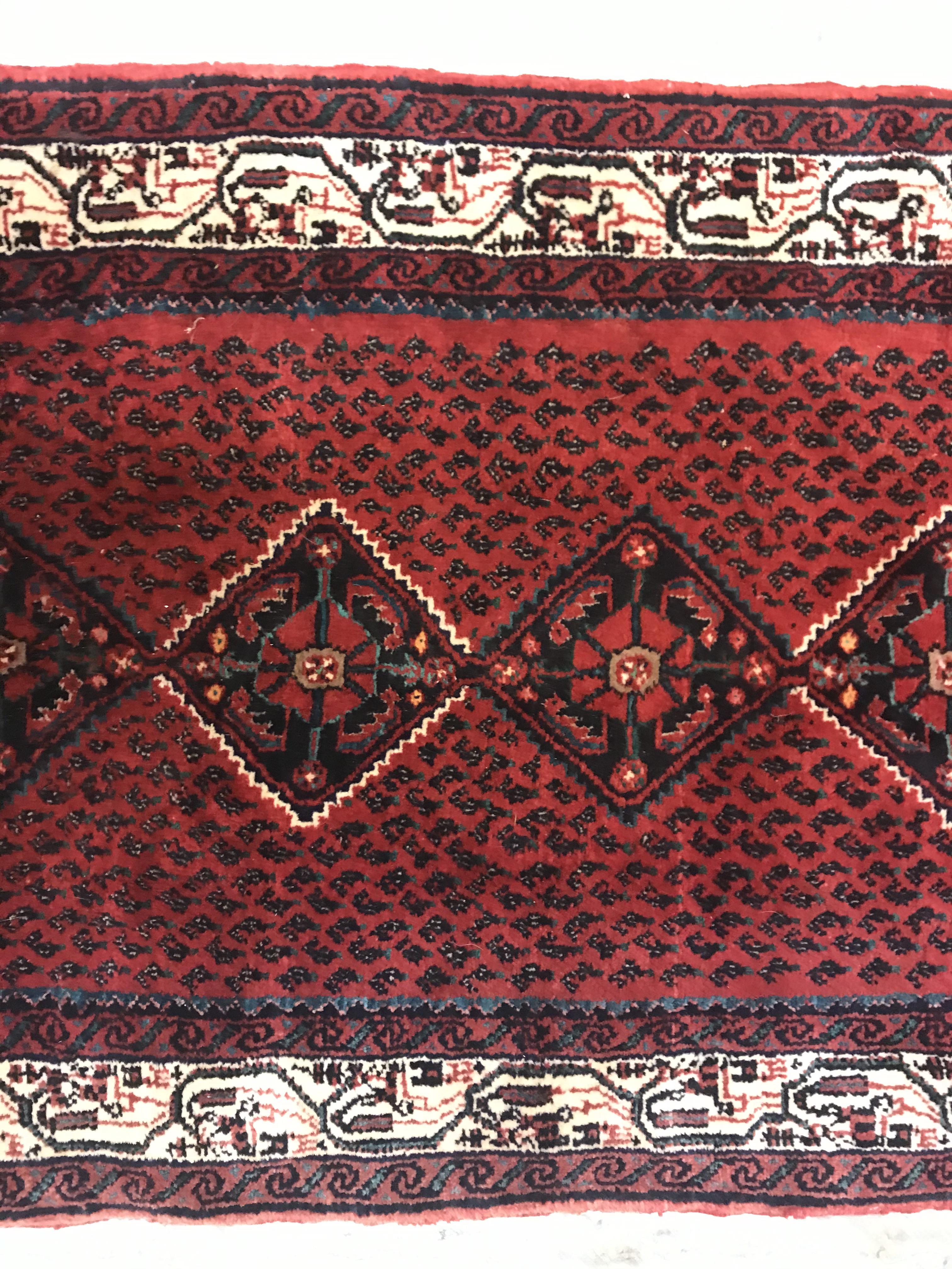 A modern Persian (Iran) runner, the red ground with repeating lozenge medallion with hook style - Image 5 of 23