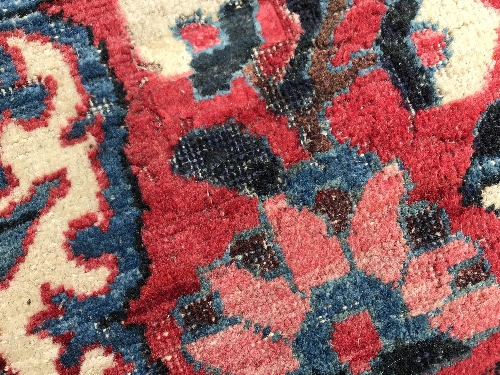 A Caucasian carpet, the central panel set with a flower head medallion on a red ground, with all - Image 6 of 10