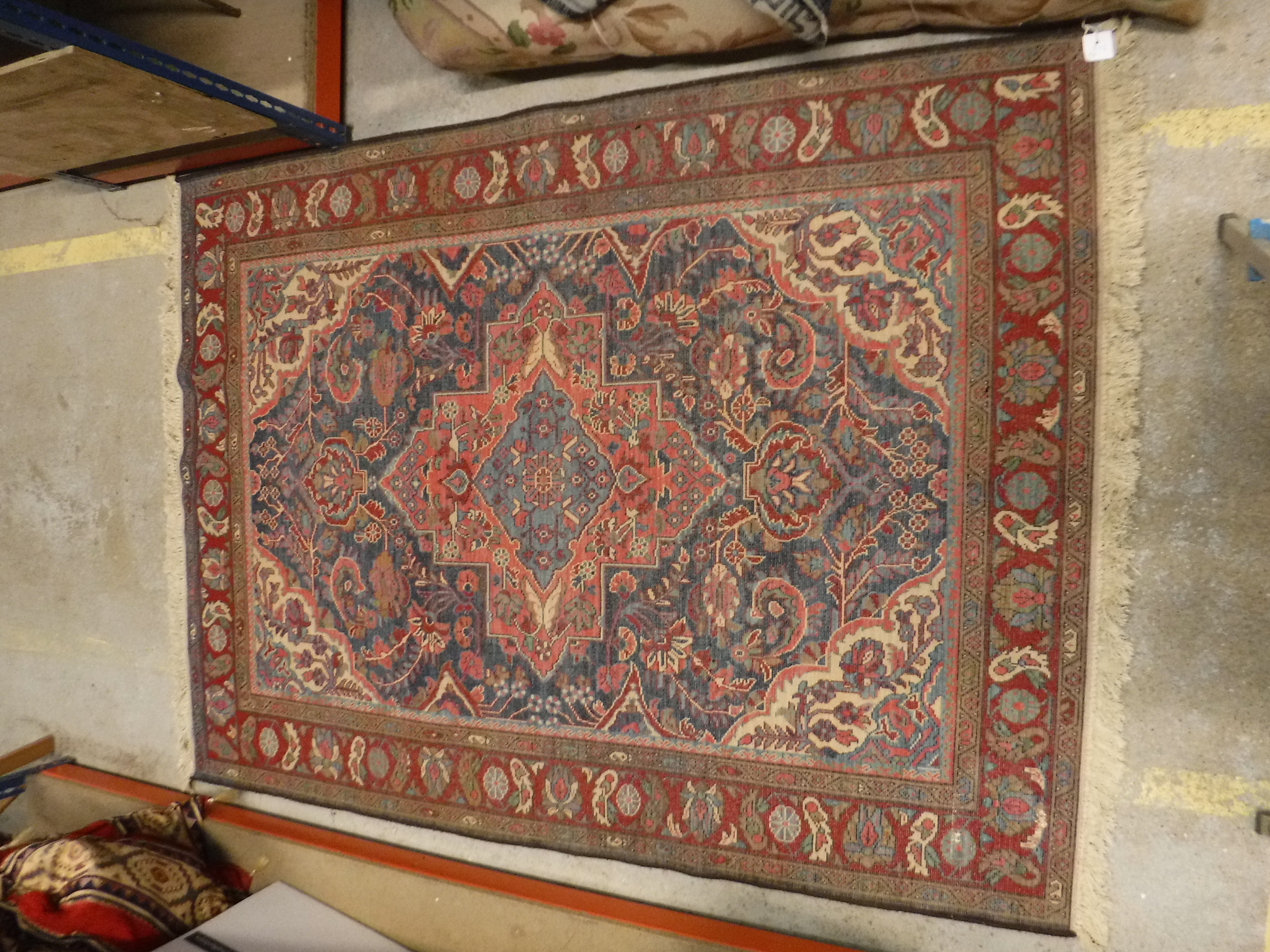 An Oriental carpet, the central panel set with foliate decorated medallion on a red and blue - Image 11 of 11