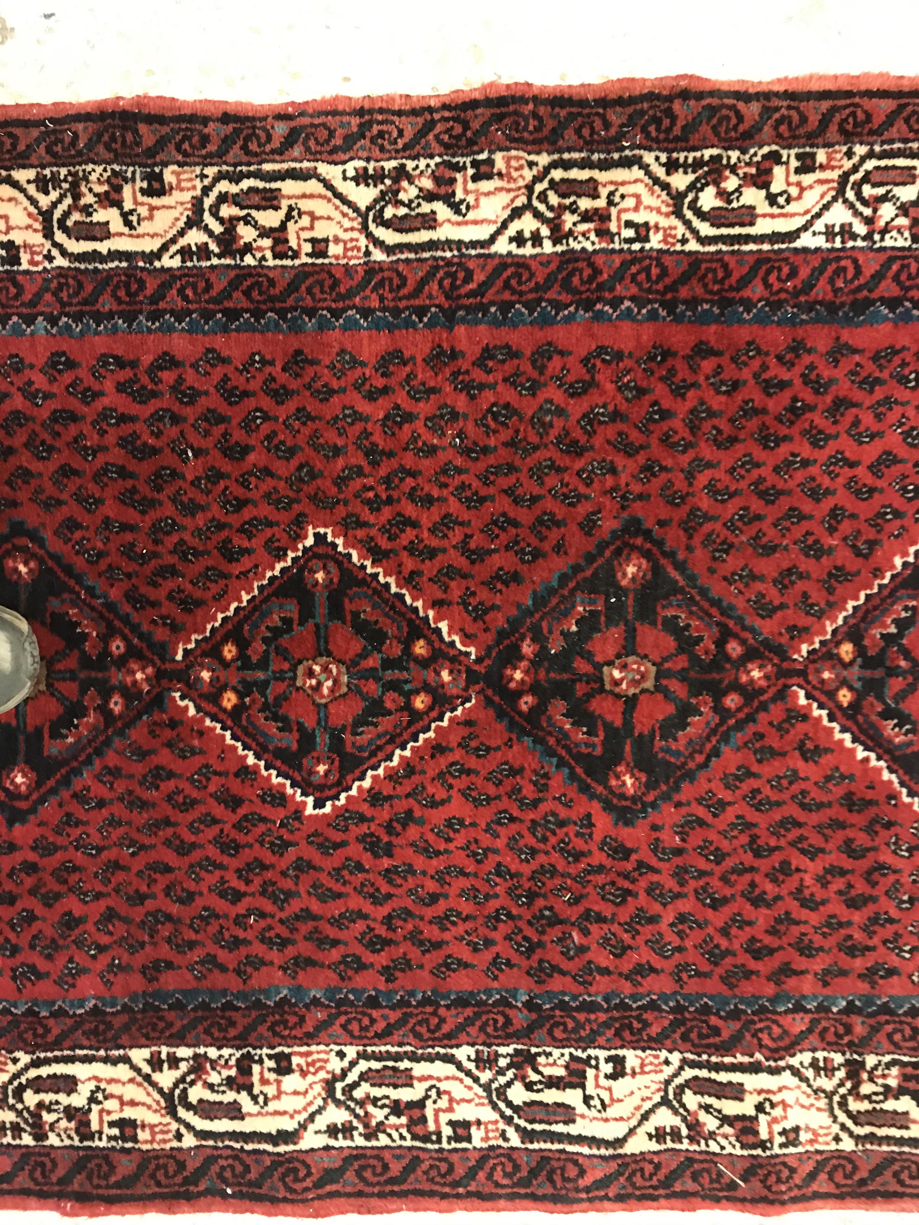 A modern Persian (Iran) runner, the red ground with repeating lozenge medallion with hook style - Image 13 of 23