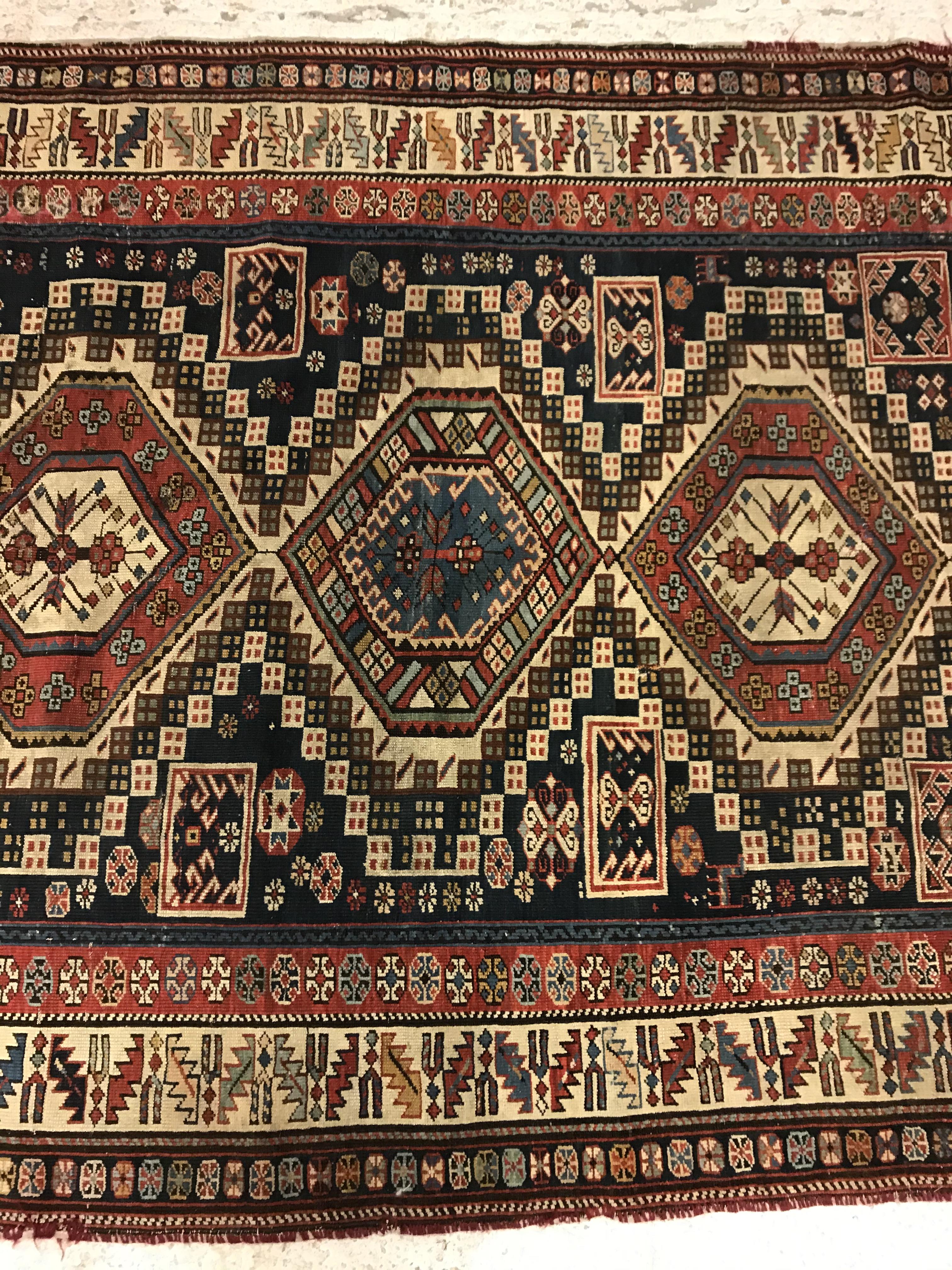 A fine Shirvan runner, the central panel set with repeating medallions on a dark blue stylised - Image 4 of 8