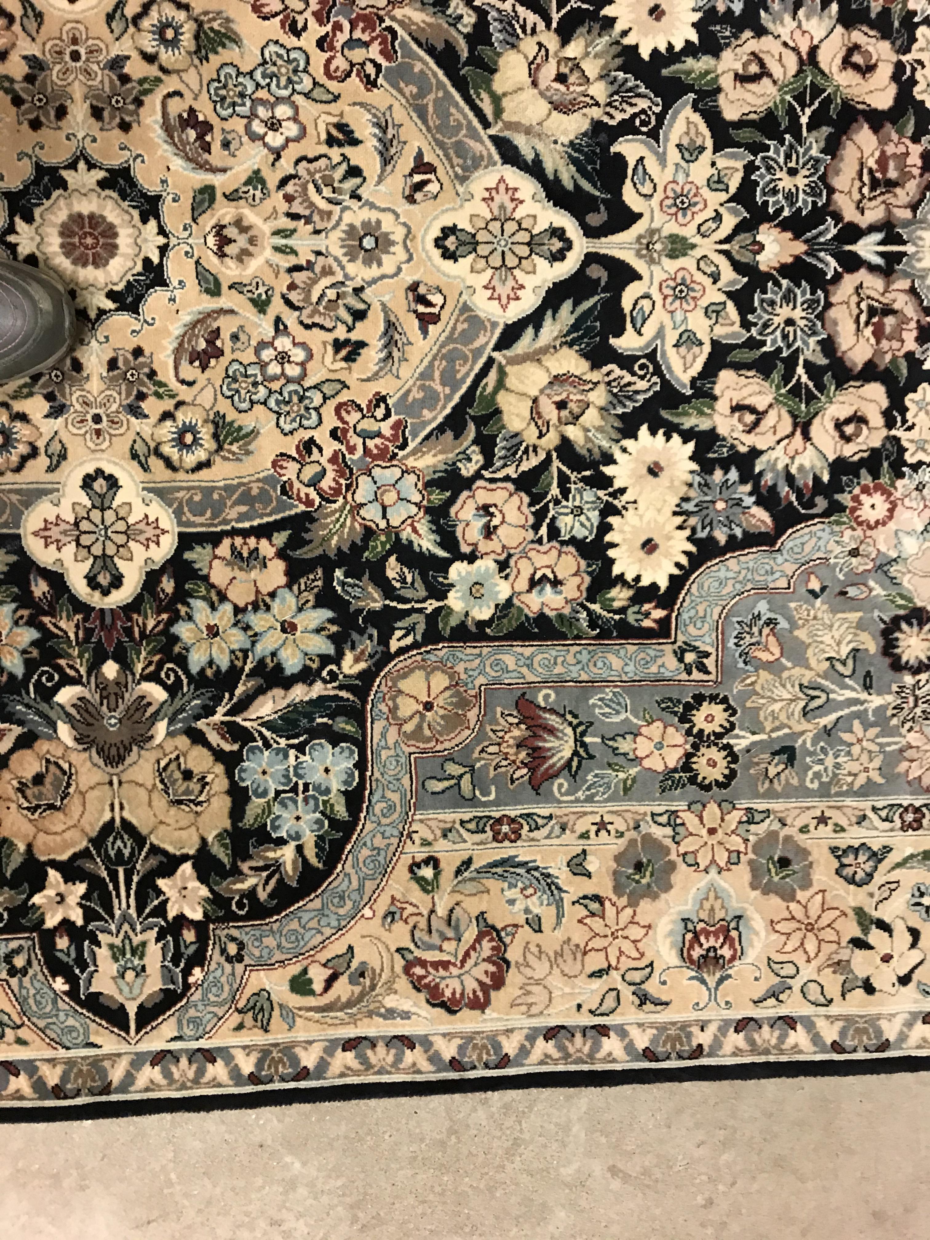 A Persian rug, the central panel set with floral decorated oval medallion on a dark blue and pale - Image 7 of 10