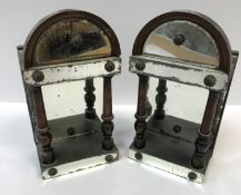 A pair of 19th Century mahogany and mirrored domed wall brackets of small proportions with column