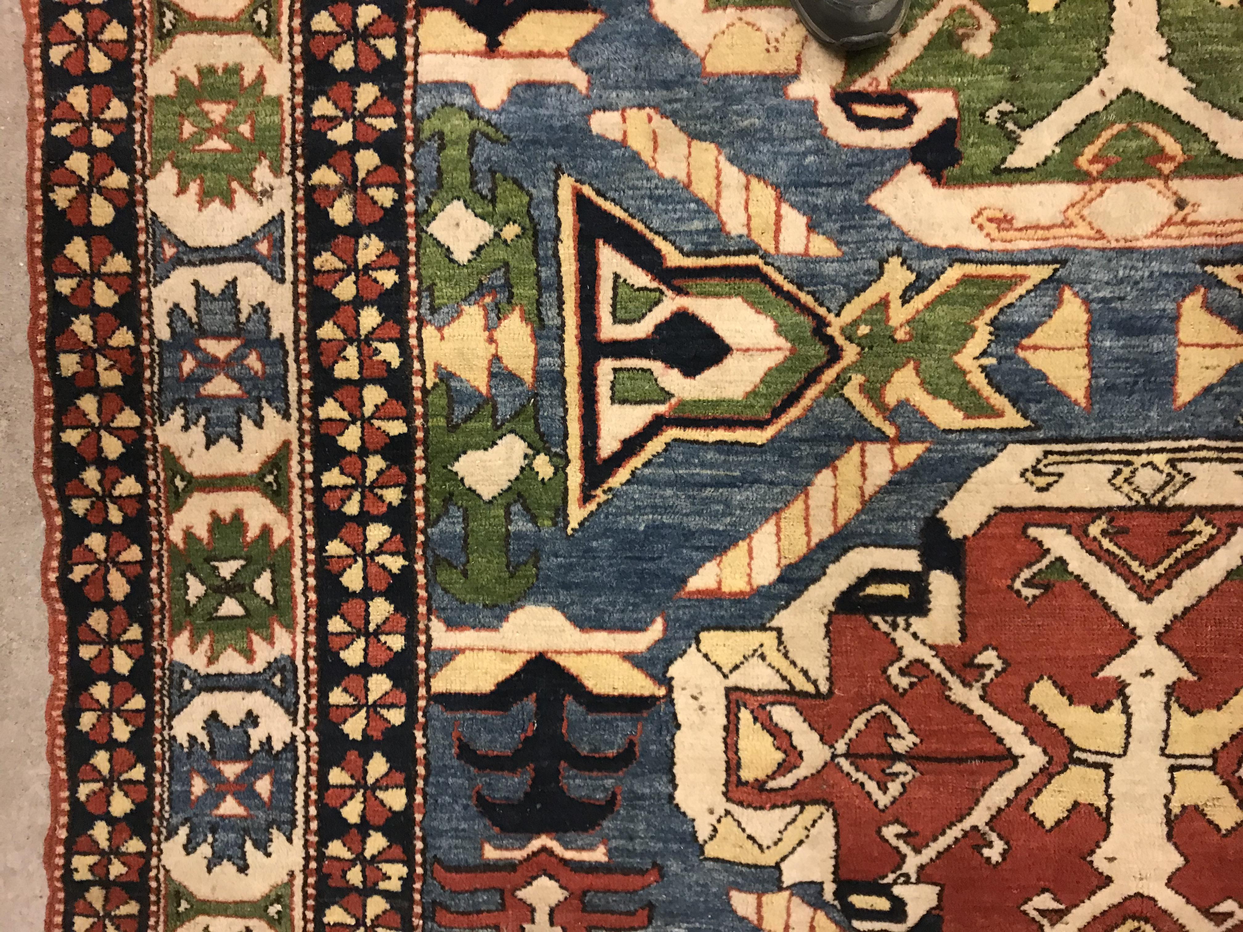 A Caucasian rug, the central panel set with three repeating medallions on a pale blue ground, within - Image 4 of 33