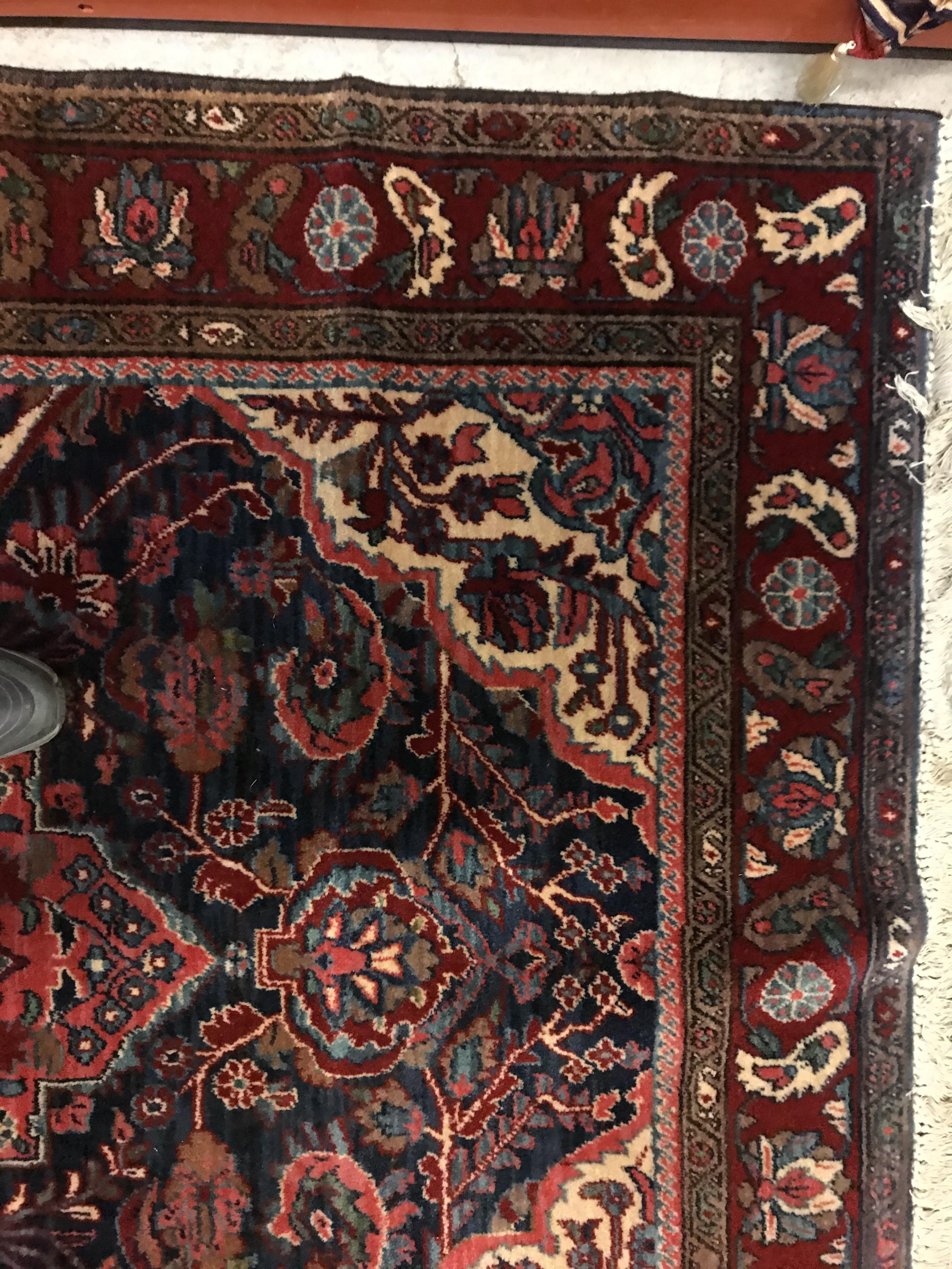 An Oriental carpet, the central panel set with foliate decorated medallion on a red and blue - Image 8 of 11