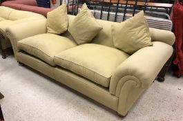 A Duresta scroll arm sofa, upholstered in olive green Zoffany fabric, raised on squat turned feet to