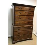 A 19th Century mahogany bachelor chest on chest, the moulded dentil cornice over four long graduated