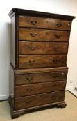 A 19th Century mahogany bachelor chest on chest, the moulded dentil cornice over four long graduated
